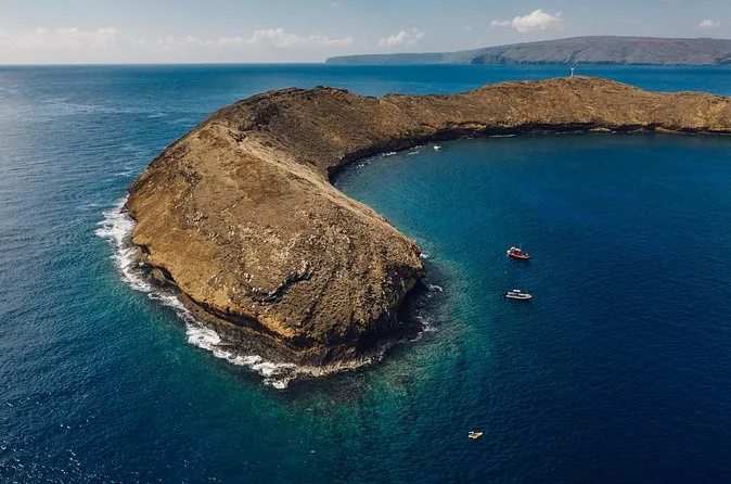 Aerial view of the Molokini crescent with two small boats inside